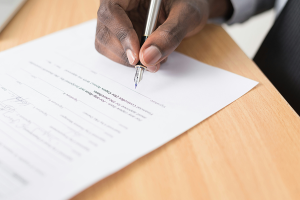 Man signing document